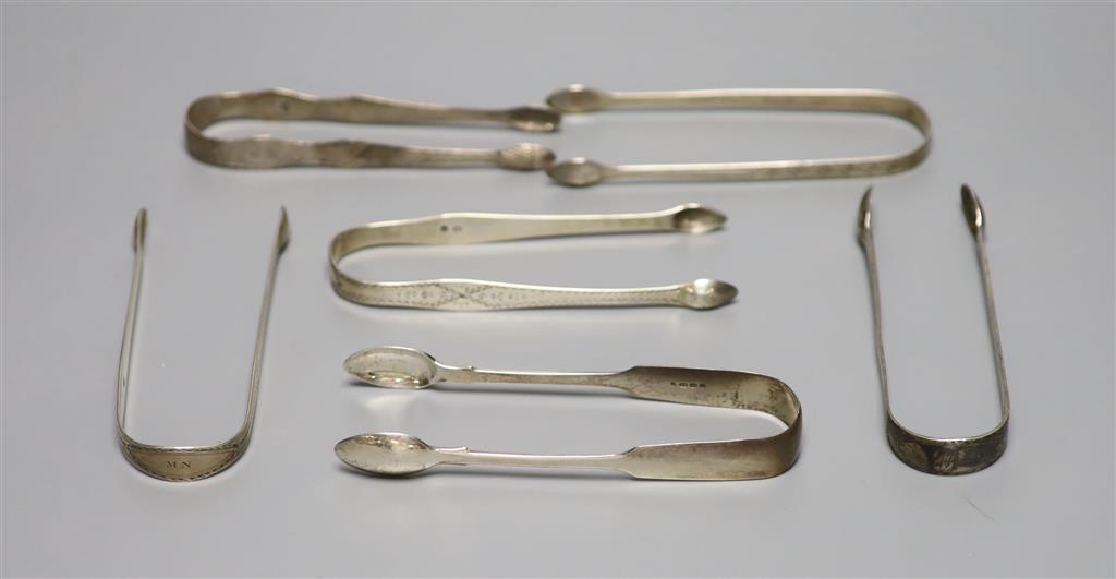 Six pairs of assorted 18th and 19th century silver sugar tongs including one bright cut engraved by Hester Bateman,